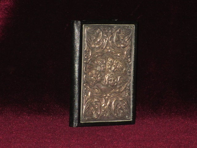Item #08734 Address Book, with Four Angels in Silver Bas-Relief on Front Panel. N/A.