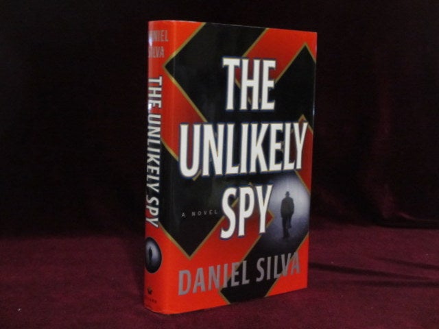 Item #09367 The Unlikely Spy (Inscribed). Daniel Silva.
